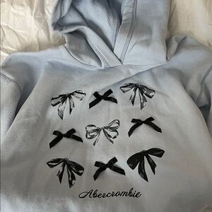 Abercrombie Kids Light Blue Hoodie with Black Bow Design 13/14